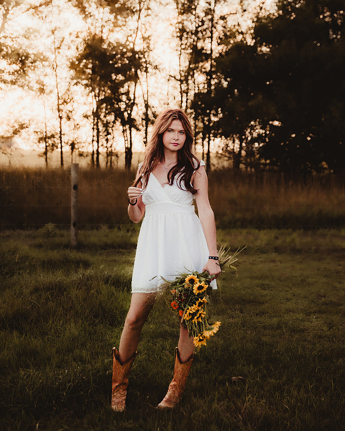 Soft light, a quiet breeze, and a moment that feels like it belongs in a memory. This is what senior photos are meant to feel like.
